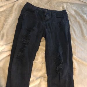 Woman’s Black patched ripped jeans